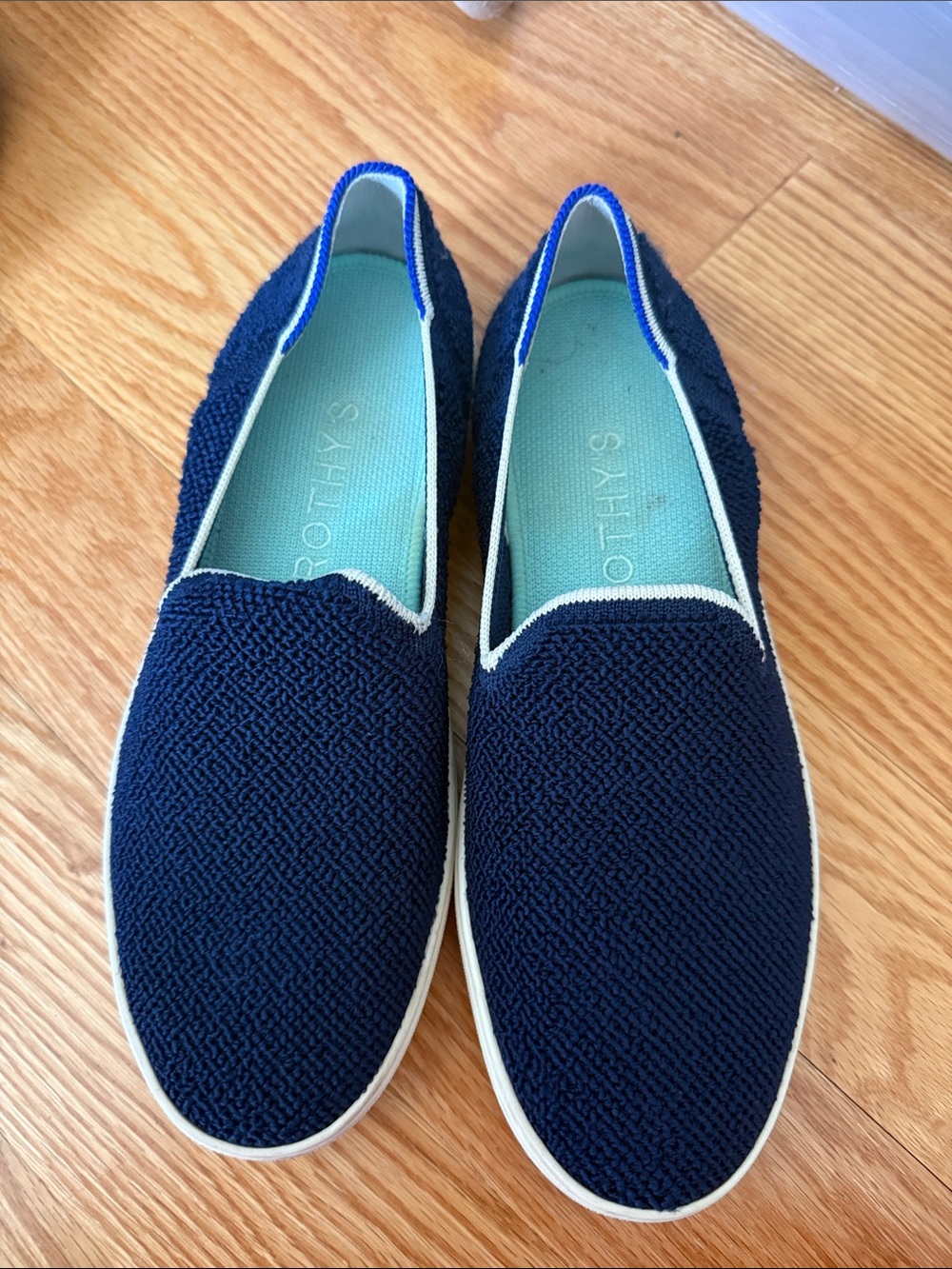 Rothy’s Navy Slip-On Loafers with Teal Insole